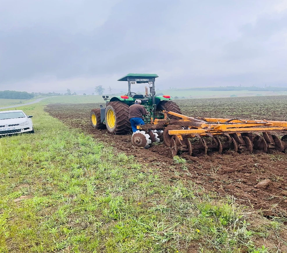Tractor and cultivation equipment preparing land